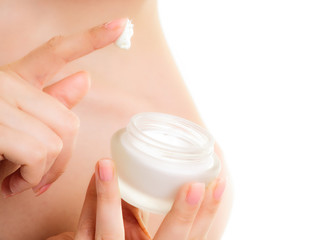 Skin care. Moisturizing cream in female hands