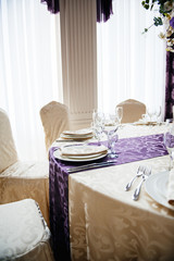 Wedding reception table setting in modern venue restaurant