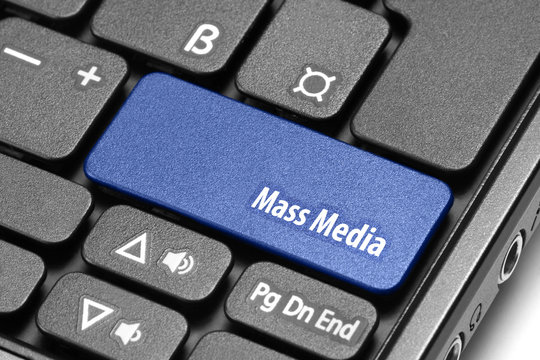 Mass Media. Blue hot key on computer keyboard