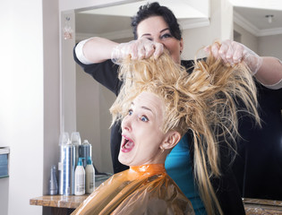Hairdresser dyes long blond hair