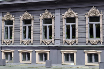 Fototapeta na wymiar Windows of the house of merchants Chiralov. Architectural monume