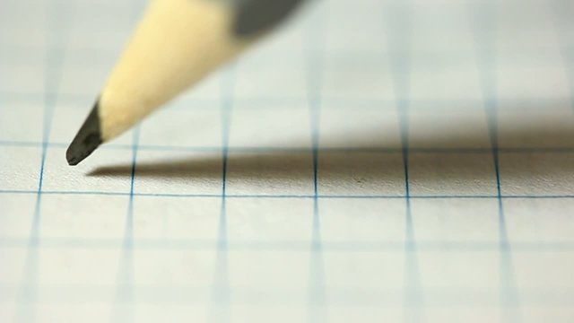 Pencil broken in writing in a notebook.
