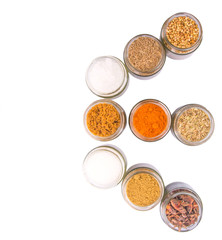 Different variety of sugar and spices over white background