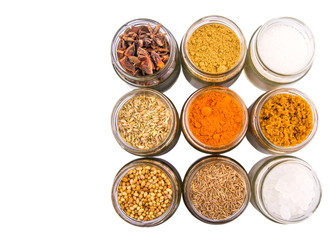 Different variety of sugar and spices over white background