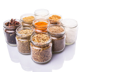 Different variety of sugar and spices over white background
