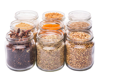 Different variety of sugar and spices over white background