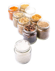 Different variety of sugar and spices over white background