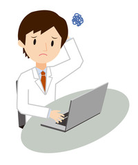 パソコン操作をしている白衣の男性