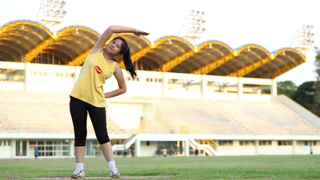 Woman warm up before running at sport stadium