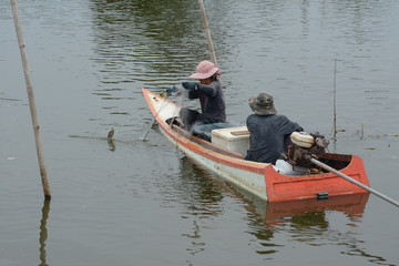 Fishing in wooden boat used  net
