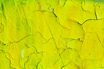 Cracked surface of yellow wall