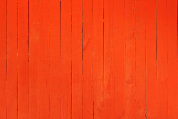Background image of a wooden wall painted in bright red color