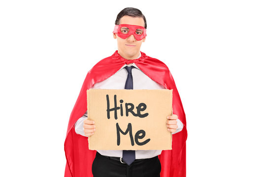 Sad superhero with a sign looking for job
