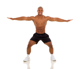 african man exercising and stretching