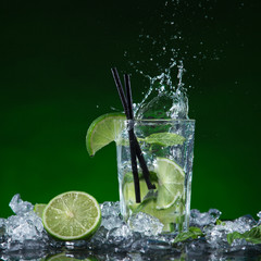 Fototapeta premium Fresh fruit cocktail in freeze motion splashing