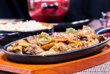 Pork in black bean souse with green pepper and onion