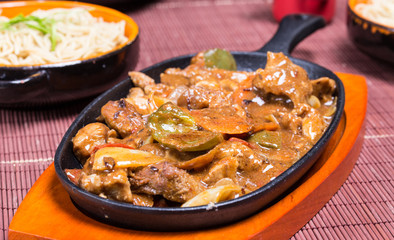 Pork in black bean souse with green pepper and onion