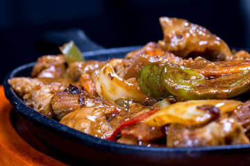 Pork in black bean souse with green pepper and onion