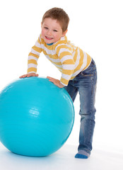 little boy with a big ball.