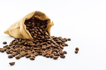 Brown roasted coffee beans in a canvas sack.