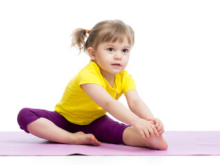 Obraz na płótnie Canvas Kid girl doing fitness exercises