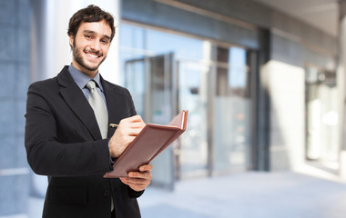 Fototapeta premium Businessman writing notes