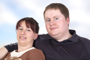 Man and woman sitting together on the sofa