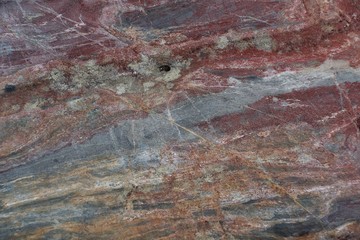 Surface of natural  stone - crimson quartzite porphyry - obrazy, fototapety, plakaty