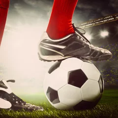 Fototapete Rund legs of a soccer player © Sergey Peterman