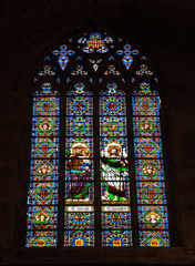 Vintage stained glass in Catholic church in Barcelona