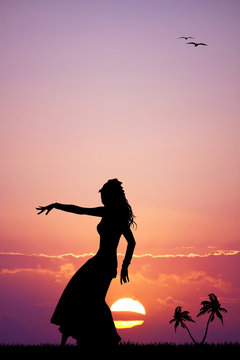 Hawaiian woman dancing at sunset