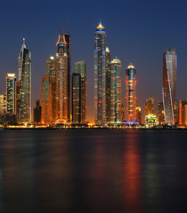 Dubai Marina at dusk as viewed from Palm Jumeirah in Dubai, UAE