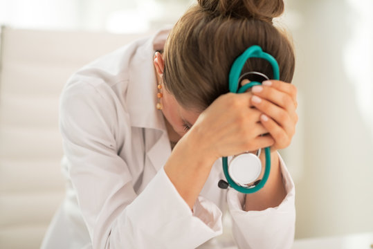 Stressed Medical Doctor Woman In Office