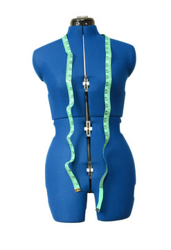 Tailor mannequin with measuring tape isolated
