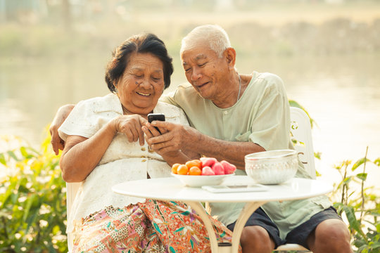 Senior couple using the mobile phone