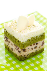 Matcha green tea cake isolated on white background