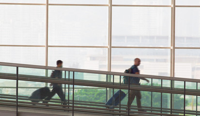 Fototapeta na wymiar Passengers at the Hong Kong airport with bags
