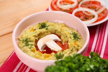 Bowl of tasty fresh hummus, close up