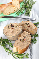 Fresh pate with bread on wooden table