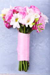 Beautiful wedding bouquet on wooden background