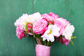 Beautiful wedding bouquet on wooden background