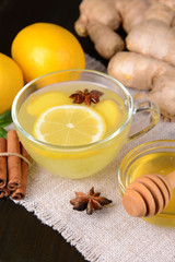 Healthy ginger tea with lemon and honey on table close-up