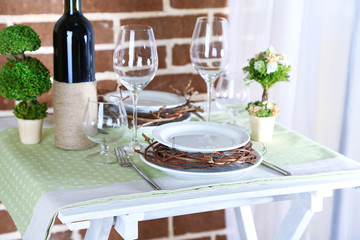 Beautiful holiday Easter table setting in green tones,