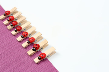 Abstract background with colorful wooden pins and paper