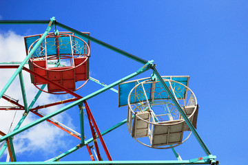 Part of colorful ferris wheel with blue sky in Thailand. - Powered by Adobe