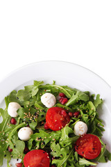 Green salad made with  arugula, tomatoes, cheese mozzarella