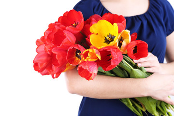 Colorful tulips in female hands isolated on white