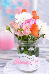 Beautiful bouquet of bright flowers in jar