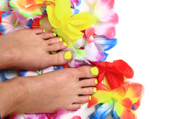 women feets and flowers (pedicure tbackground)