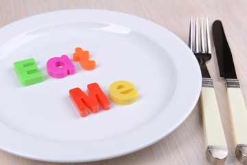 Plate with inscription on table close-up